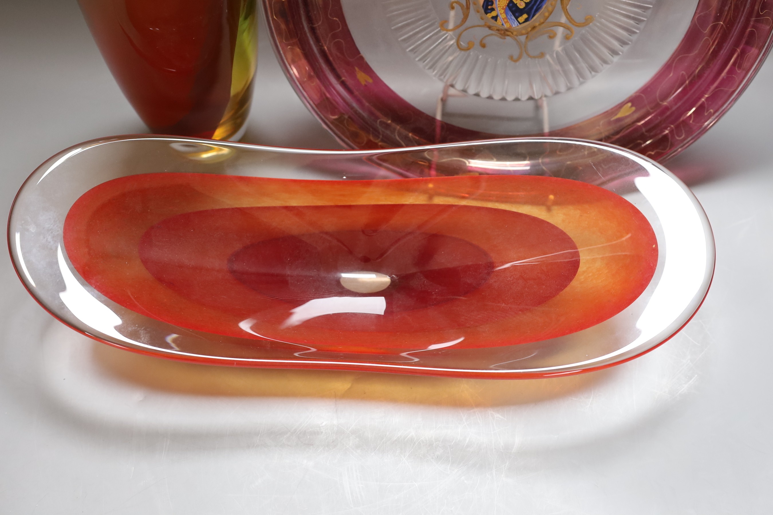 A Kosta Boda glass vase, signed K Engman, a signed art glass dish and a large French glass plate, tallest 54cm